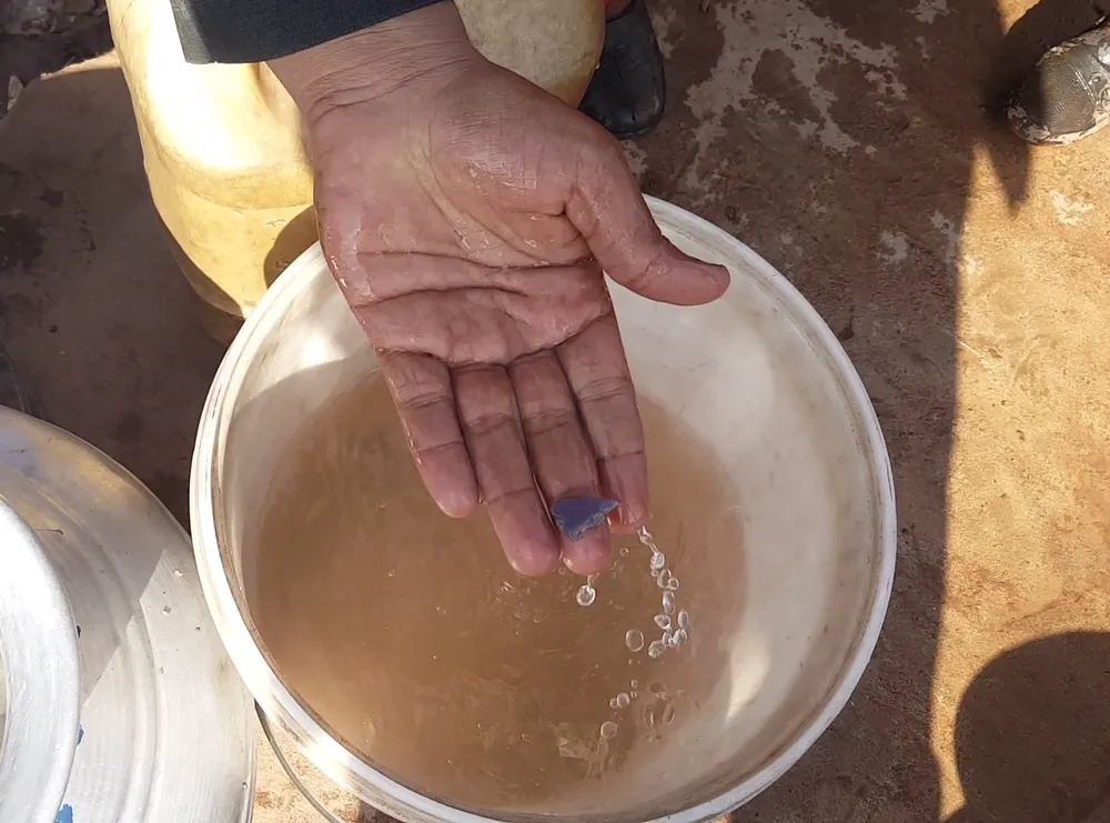The settlement’s water supply before the household-filter project, outside Islamabad.
