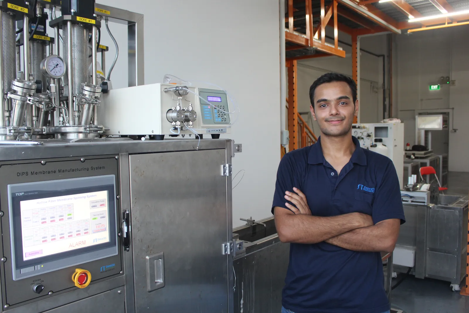At the fiber-spinning system in the Singapore laboratory.